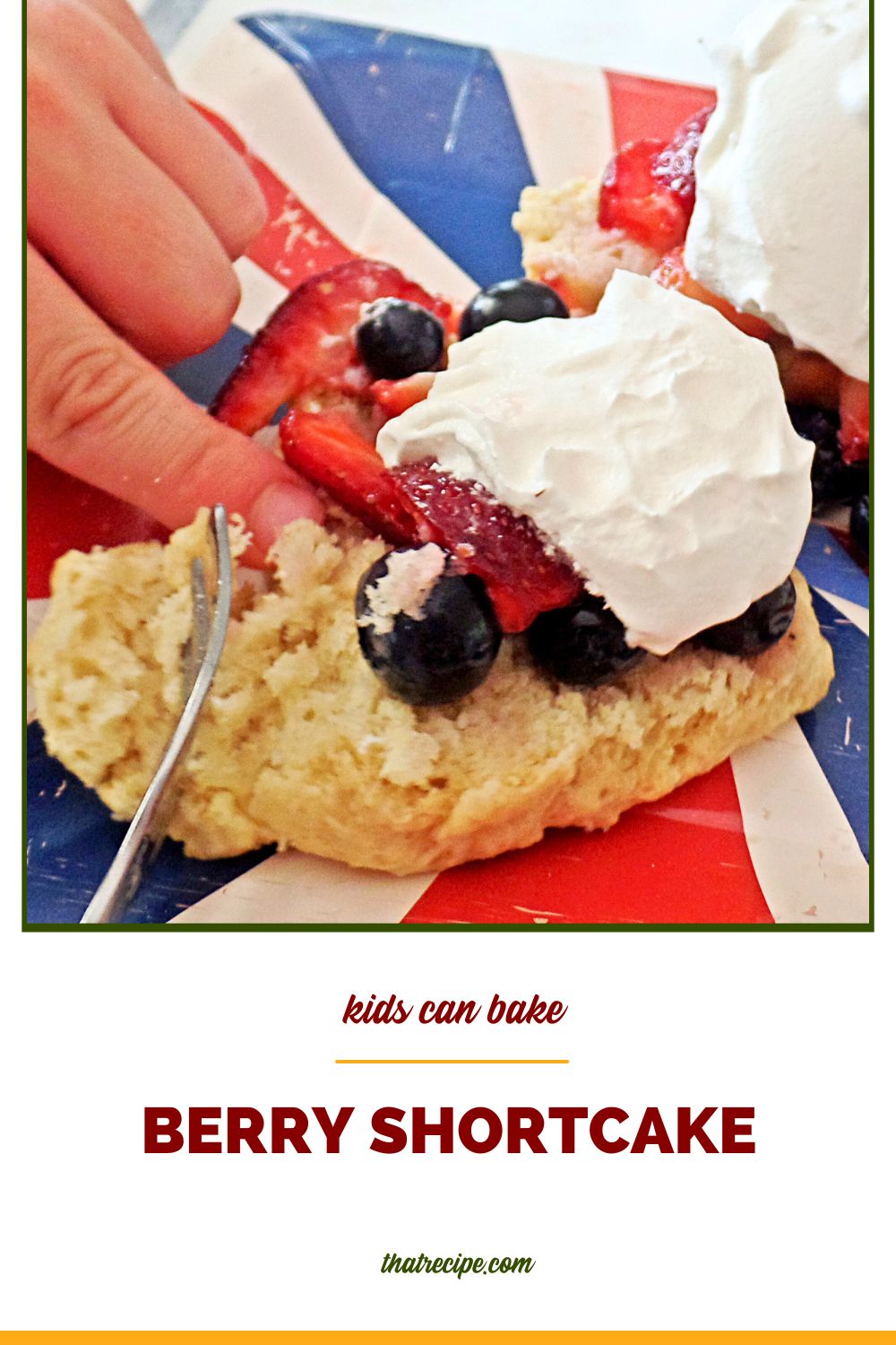 child hand cutting berry shortcake